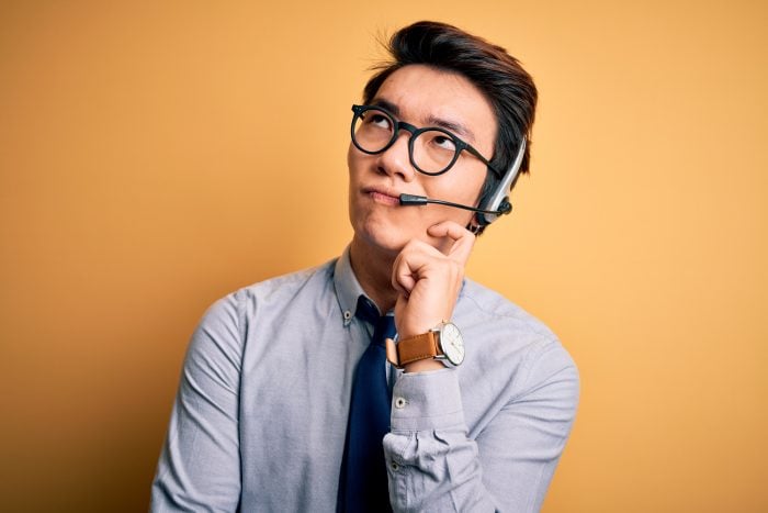 Call center agent thinking about what to say next