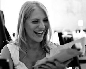 A young woman laughing and shopping