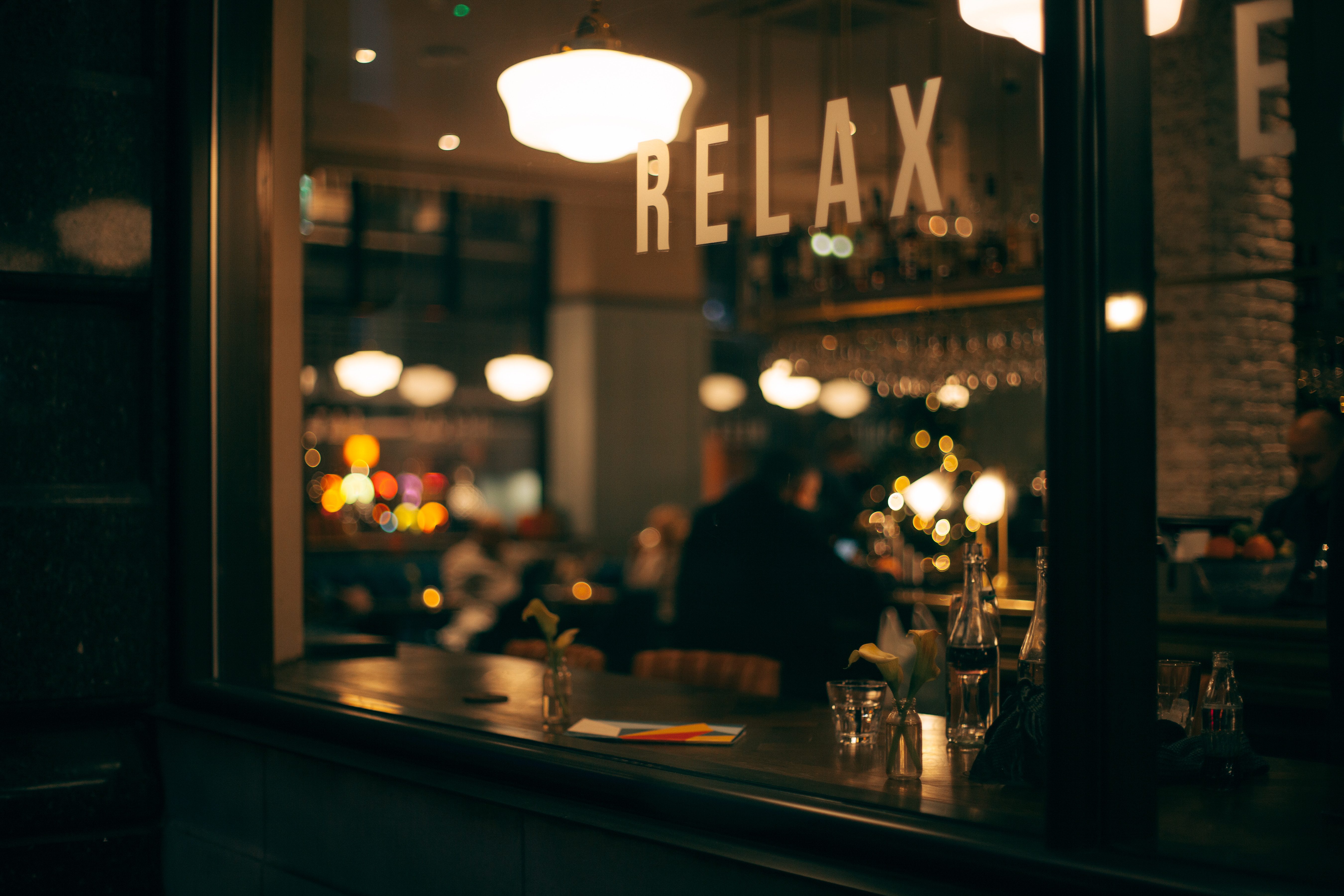 Relax sign in a shop window. Photo by Clem Onojeghuo on Unsplash