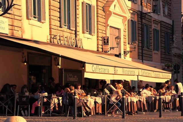 People Sitting Outside Caffetteria During Daytime